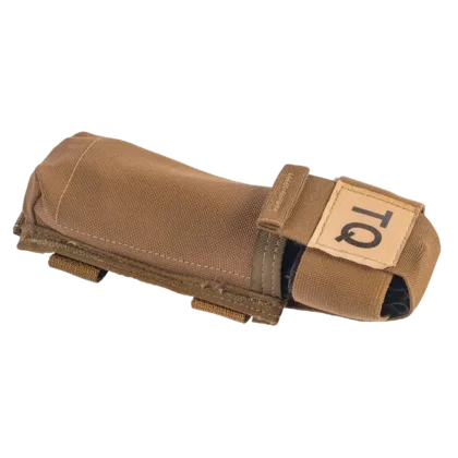 The C-A-T® Holder, COY, is designed for rapid access and secure storage of Gen 6 and Gen 7 C-A-T® Tourniquets on vests or gear using MOLLE/PALS-style connectors. It features an easy-open elastic pull tab and provides protection from the elements.