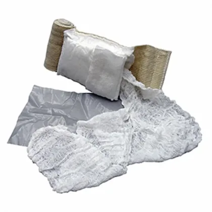 The Olaes® Modular Bandage 4", flat packed, is a versatile trauma bandage designed for all levels of care providers. It features 3 meters of gauze, a removable occlusive plastic sheet, and a pressure bar that can serve as an eye cup, with Velcro® 'Control' strips to prevent unraveling.