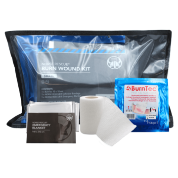 The NORSE RESCUE® Burn Wound Kit, Small, is a compact and lightweight first aid solution specifically designed for the effective treatment of burn injuries in pre-hospital settings. Ideal for distribution during mass casualty incidents, this kit includes essential items such as the advanced BurnTec hydrogel dressing, a NORSE RESCUE® Cohesive Bandage, and a NORSE RESCUE® Emergency Blanket, ensuring immediate relief and protection for burn victims. The kit's contents can be customized to meet specific requirements. - EE-00538