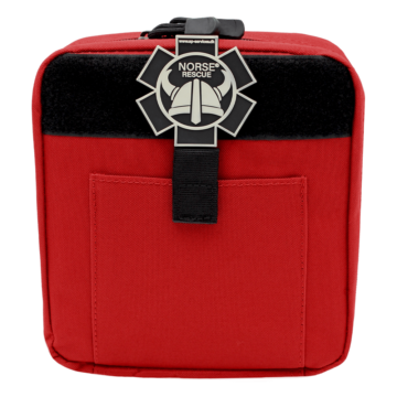 The NORSE RESCUE® IFAK, RED, features a distinctive Red and Black Leg Rig, a lightweight, adaptable bag designed for personalized first aid needs. It offers a main compartment for organized storage and easy access to essential medical supplies. Attachable to either a belt or thigh, this high-quality leg rig suits various personal preferences and comes equipped with a Velcro front for attaching individual patches (content and patches sold separately). - IF-AP-RED