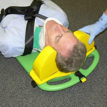 The CombiCarrierII Head Immobilizer (Yellow) is designed for seamless use with the CombiCarrierII, ensuring minimal lateral movement and maximizing neck and ear access while maintaining stabilization. Constructed from easy-to-clean vinyl-dipped NBR.