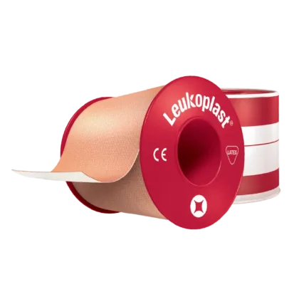 Leukoplast® Standard Rigid tan-coloured zinc oxide tape, 5cm x 5m, offers strong adhesion and high tensile strength, ideal for securing dressings and equipment on intact skin. It's water-repellent, breathable, and features antimicrobial components.