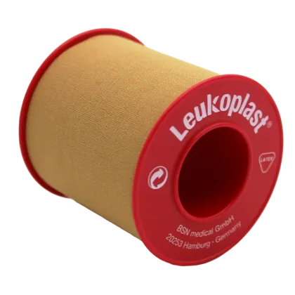 Leukoplast® Standard Rigid tan-coloured zinc oxide tape, 5cm x 5m, offers strong adhesion and high tensile strength, ideal for securing dressings and equipment on intact skin. It's water-repellent, breathable, and features antimicrobial components.