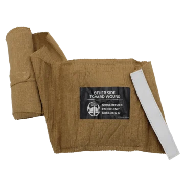 The NORSE RESCUE® Emergency Dressing 6" is a sterile, multi-functional bandage designed for swift and efficient application under stress. Its unique features include Fast-Grip Roll Control tabs for secure deployment, a durable securing device, and a simple, all-in-one design that eliminates the need for pressure bars and hooks. Packaged in a vacuum-sealed, low-cube format with distinctive RED TIP ID® tear notches, it’s an affordable solution for effective immediate care. - CL-500006