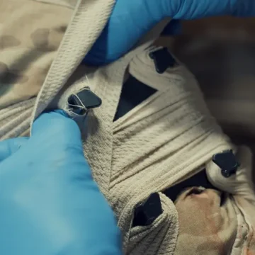 The NORSE RESCUE® Bandage Anchoring Device (B.A.D.) enhances trauma bandage stability, providing additional pressure and securing options, particularly in challenging areas. With its four-point anchoring system, it ensures secure placement during patient transport or movement, aiding in effective wound care for adults and children. For trained personnel only. - CL-100750