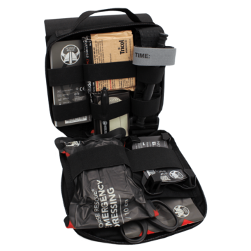 The NORSE RESCUE® Týr Bag in black is a durable and spacious personal medical bag designed for battlefield and emergency response use. Made from high-quality CORDURA® fabric with YKK zippers and a UTX safety buckle, it offers exceptional durability and secure storage. Featuring a tear-off panel for quick access, internal elastic webbing for organized storage, and ample space for essential trauma and emergency medical supplies, this bag ensures users are prepared for critical situations. - BA-100036